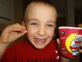 Kid Loses Tooth With Roll Up The Rim To Win